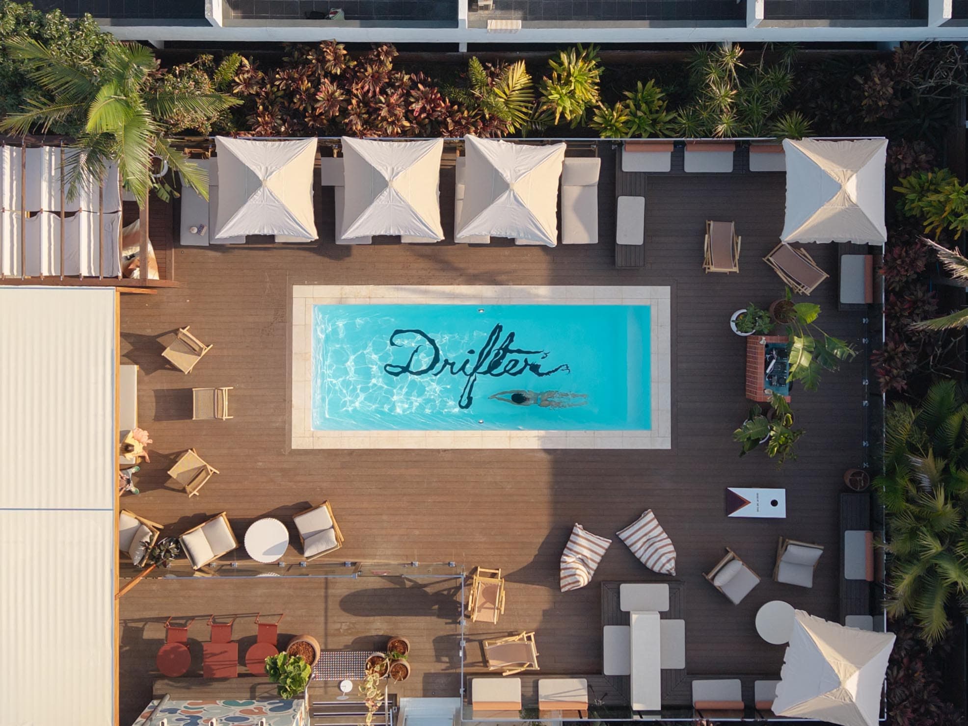 Aerial view of the pool area at a Drifter property