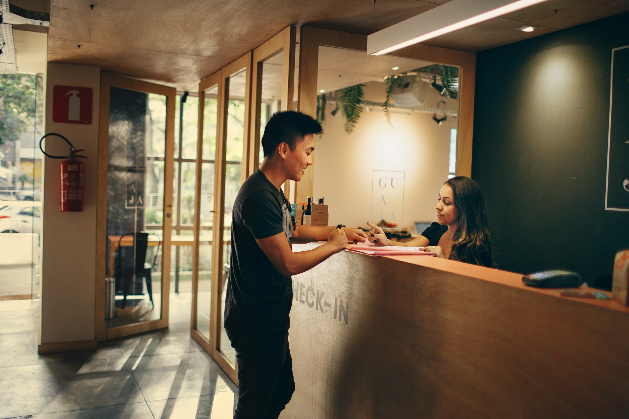 Guest checking in at a hotel front desk
